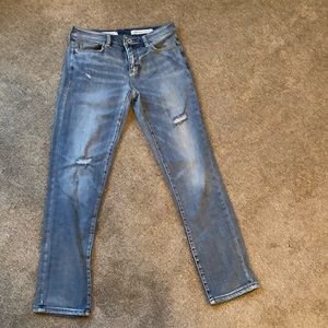 Anthropology woman slim  boyfriend jeans.